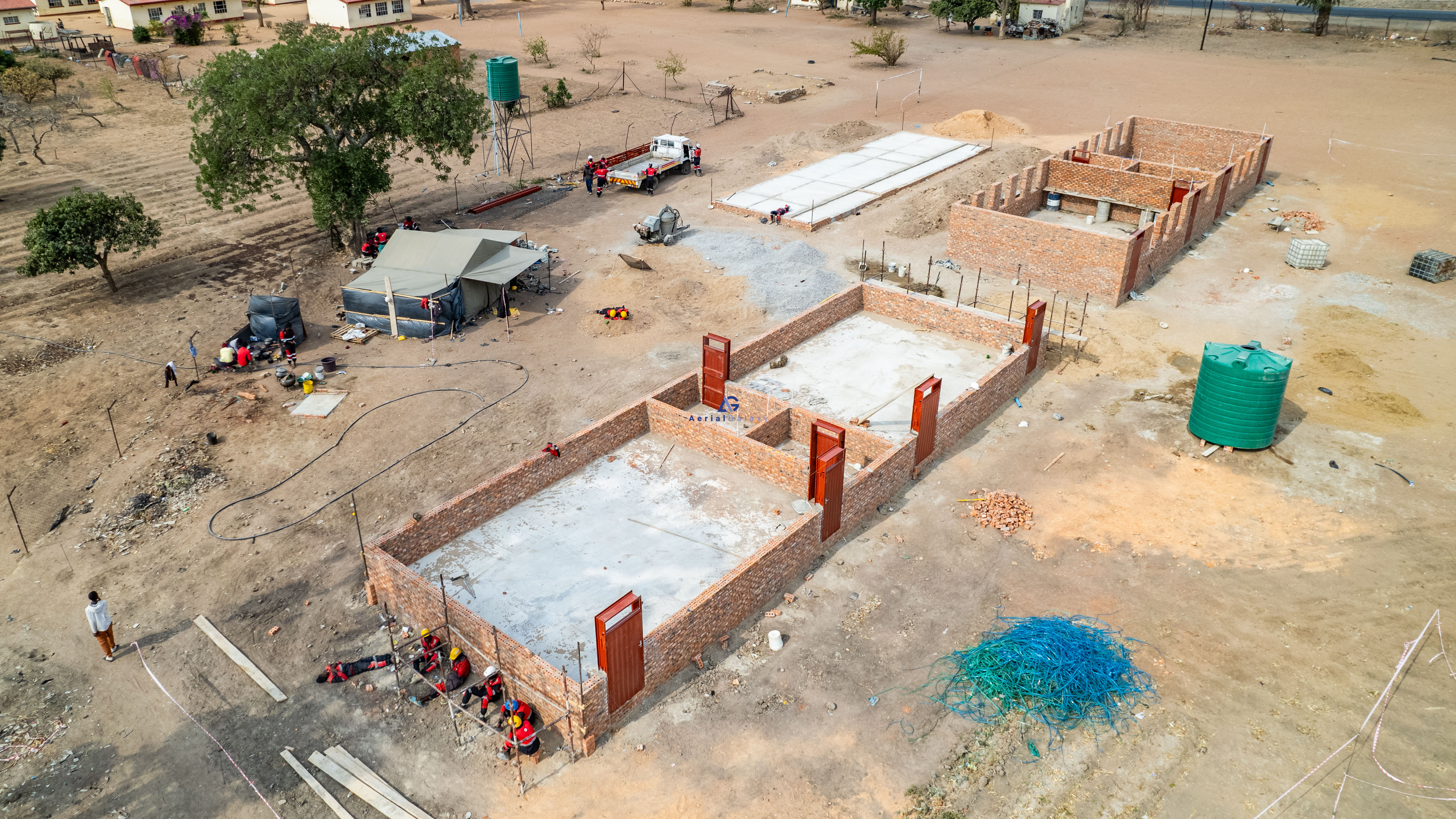 Aerial view of the same construction site after a milestone
